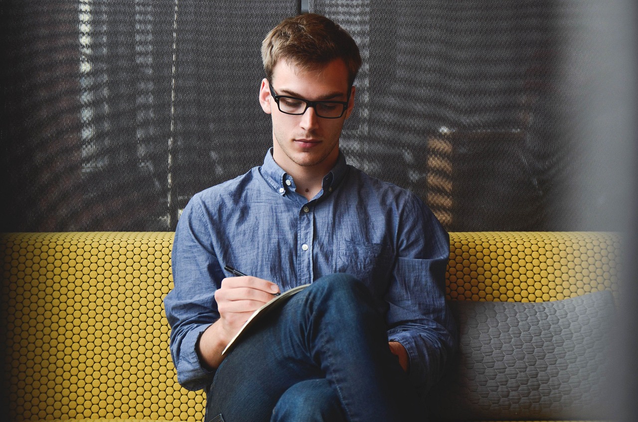 Man writing in a notebook